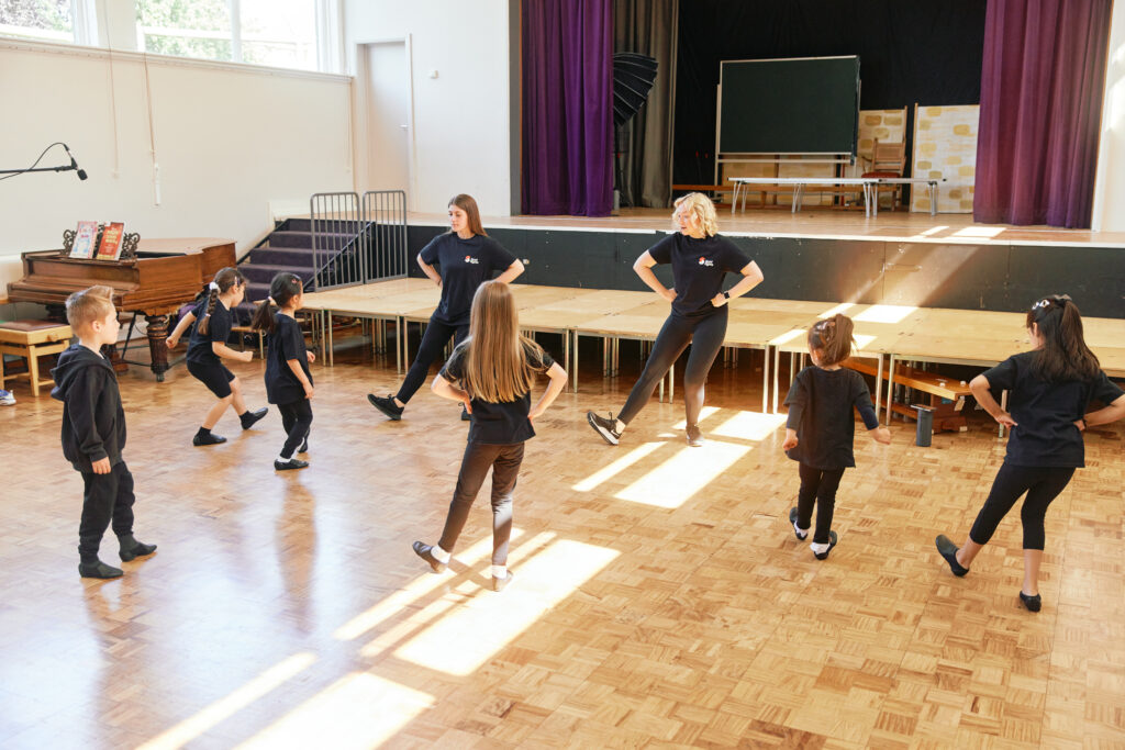 spotlights class practicing performing